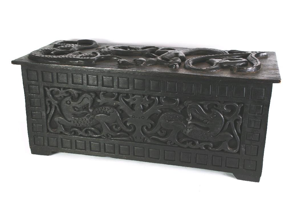 Appraisal: ETHNIC CARVED WOODEN CHEST the removable lid in bold relief