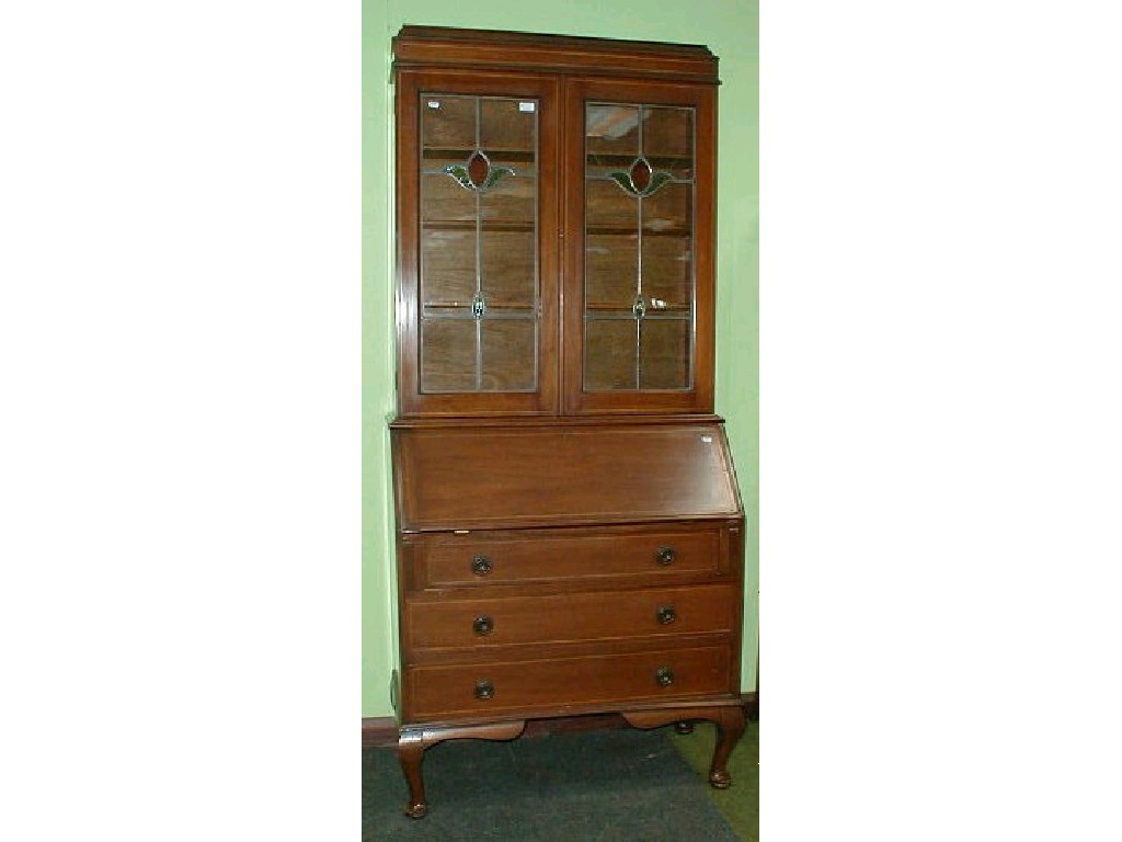 Appraisal: An Edwardian string inlaid mahogany bureau bookcase on cabriole legs