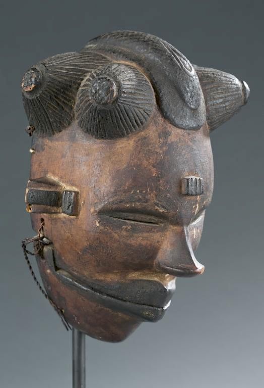 Appraisal: Mask with articulating jaw A mask with articulating jaw two