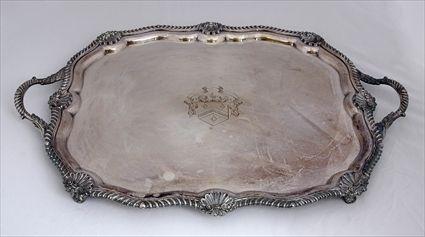 Appraisal: ENGLISH ARMORIAL SILVER-PLATED TWO HANDLED TEA TRAY The oblong surface