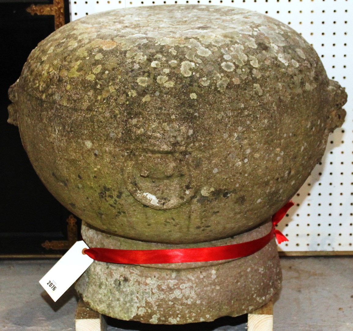 Appraisal: A pair of granite stands of globular form relief carved