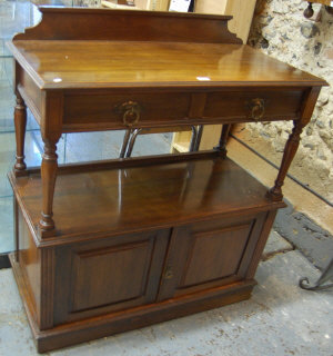 Appraisal: A Victorian walnut buffet sideboard with shallow raised back and