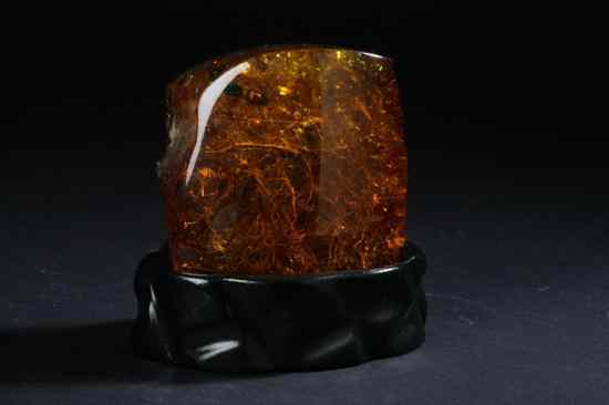 Appraisal: CHINESE AMBER PEBBLE With inclusions - in high