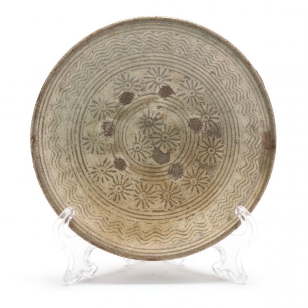 Appraisal: A KOREAN BUNCHEONG DISH WITH CHRYSANTHEMUMS Probably Goryeo period -