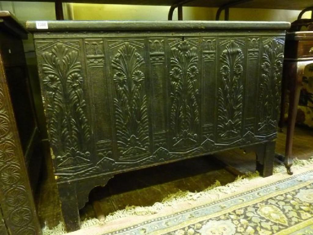 Appraisal: An old stained pine coffer partially leather clad covered with