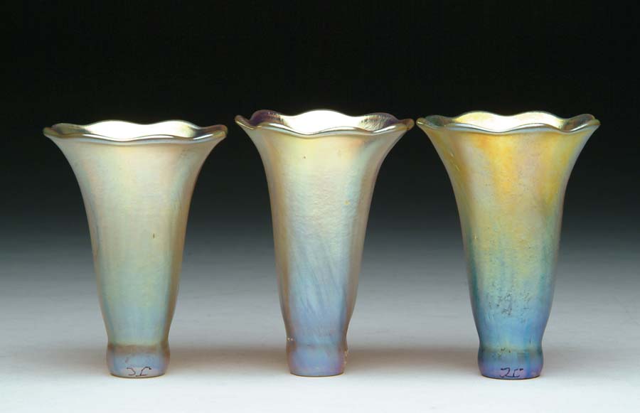 Appraisal: THREE TIFFANY LILY SHADES Iridescent gold finish with slight vertical