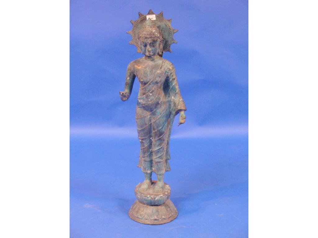 Appraisal: A cast patinated standing figure of a Buddha with pendulous