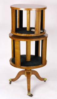 Appraisal: Edwardian two-tier double revolving bookcase executed in light wood veneer