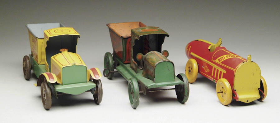 Appraisal: LOT OF THREE TIN VEHICLES Including a Nonpareil sand and