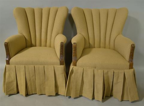 Appraisal: PAIR OF CARAMEL TWEED UPHOLSTERED CHANNELED ARMCHAIRS WITH PLEATED SKIRTS