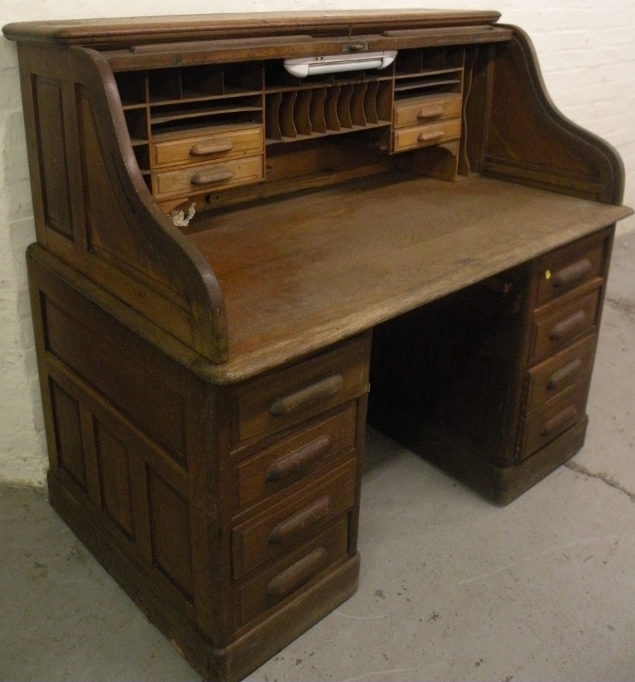 Appraisal: A 's oak tambour fronted writing desk the fall front