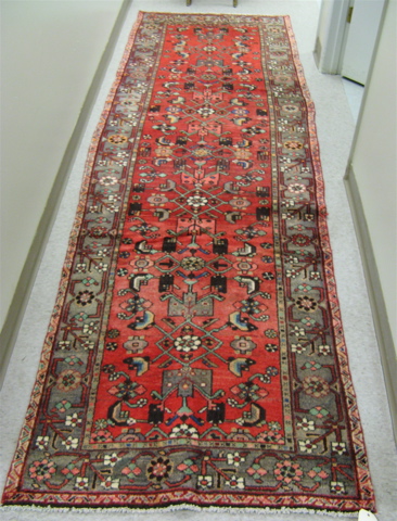 Appraisal: PERSIAN HAMADAN RUNNER Herati floral decoration on red ground '