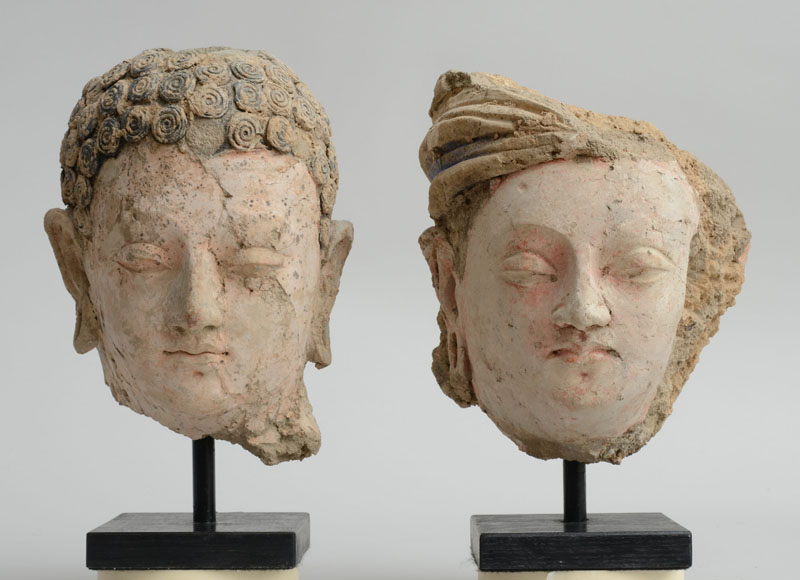 Appraisal: GANDHARAN POLYCHROME HEAD OF BUDDHA AND ANOTHER OF A BODHISATTVA