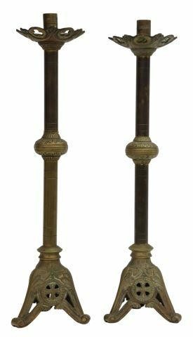 Appraisal: pair Continental patinated metal altar candlesticks cylindrical standard ending in