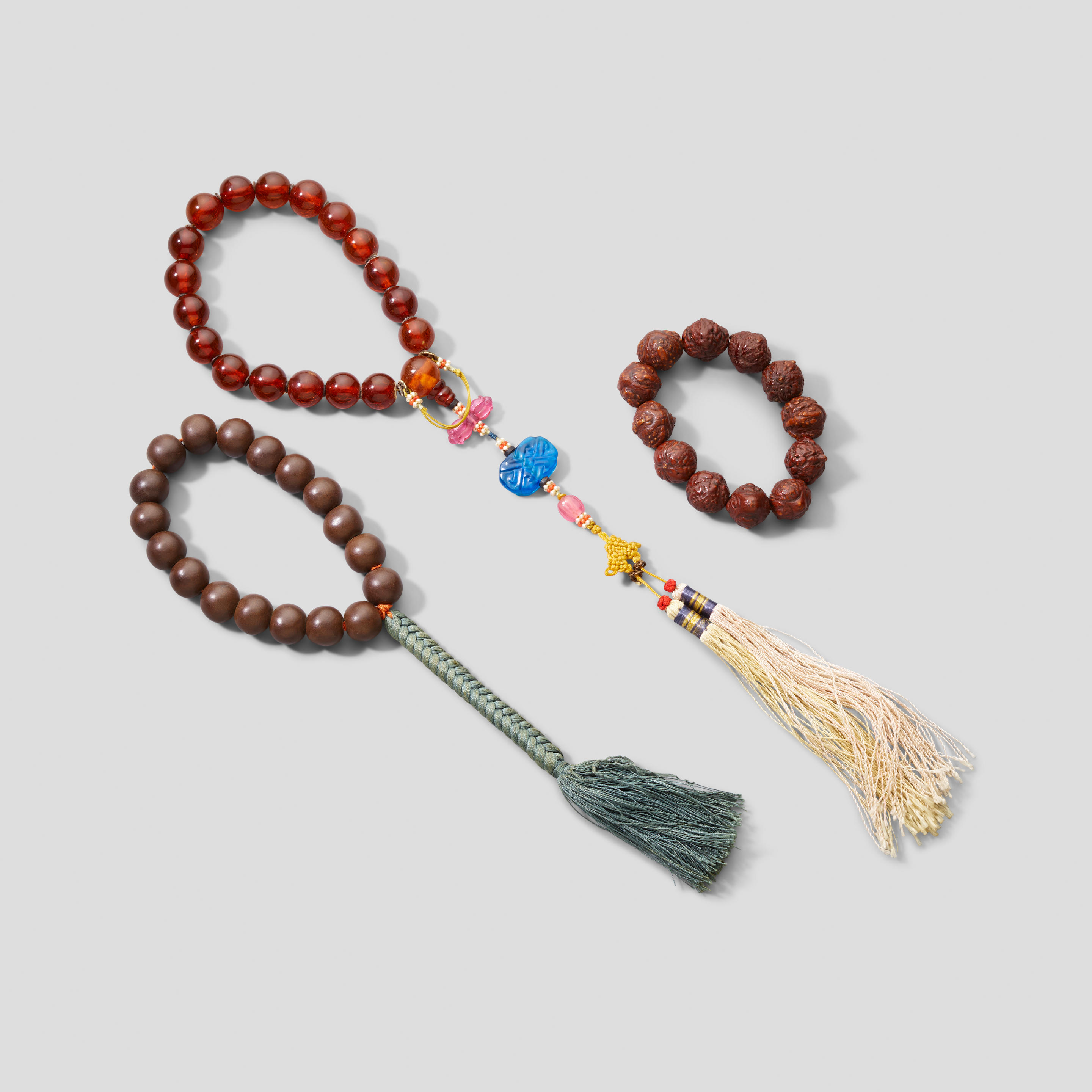 Appraisal: A GROUP OF THREE ASSEMBLED ROSARIES MALA Including a rosary