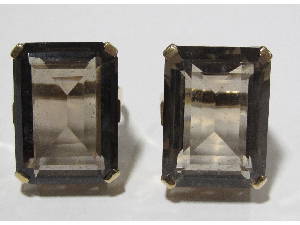 Appraisal: Two ct gold cushion cut smokey topaz single stone rings