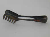 Appraisal: A pair of Italian silver serving tongs standard by Ricci