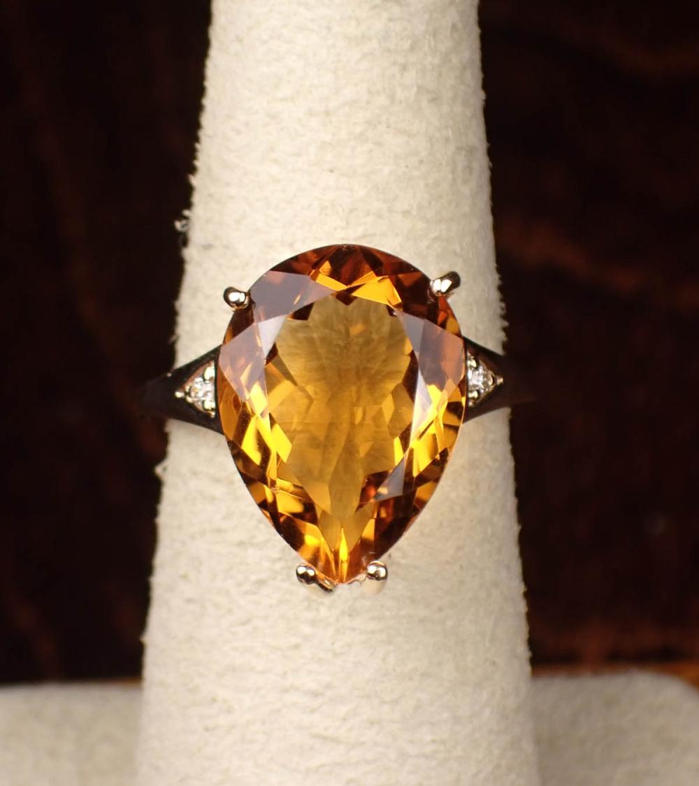 Appraisal: CITRINE DIAMOND AND FOURTEEN KARAT GOLD RING The yellow gold