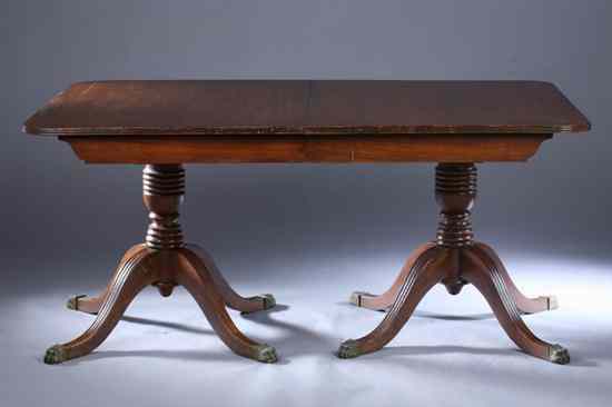 Appraisal: REGENCY STYLE MAHOGANY DOUBLE-PEDESTAL DINING TABLE Rectangular top having rounded