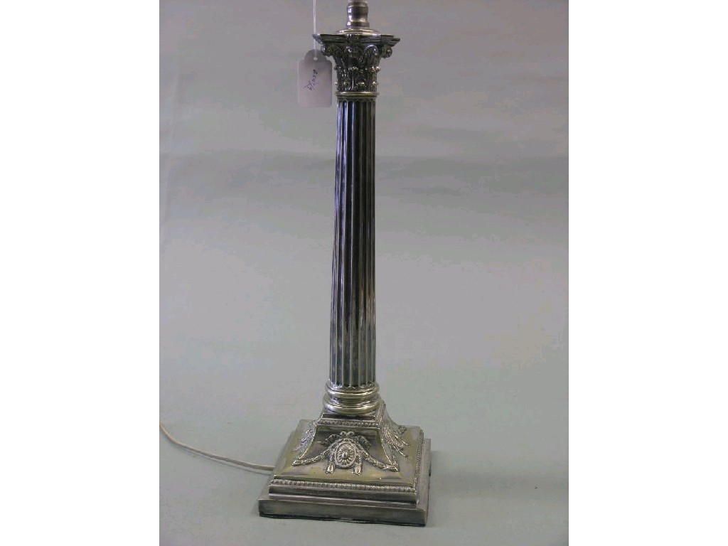 Appraisal: An electric table lamp silver plated stem in the form