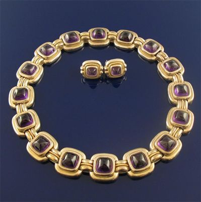 Appraisal: A cabachon amethyst mounted silver and gold necklace with matching