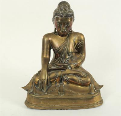 Appraisal: An Eastern bronze figure of a seated buddha with right