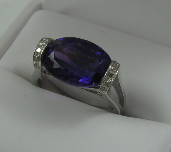 Appraisal: AMETHYST DIAMOND AND FOURTEEN KARAT GOLD RING The white gold