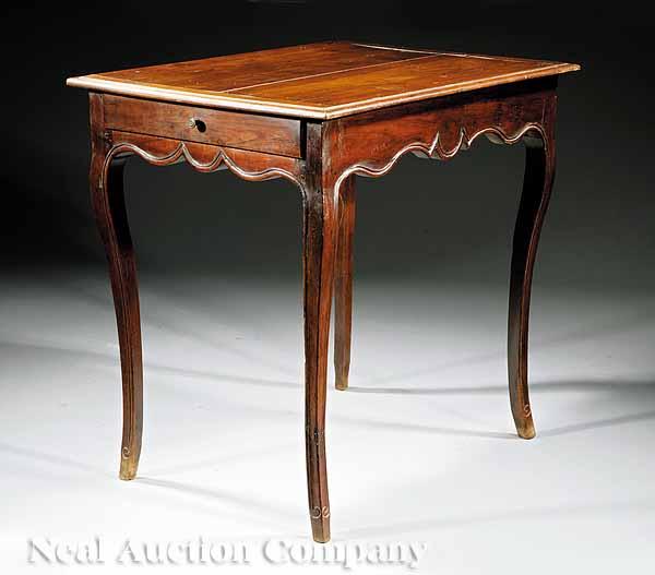 Appraisal: A Louis XV Carved Walnut Table c paneled and molded