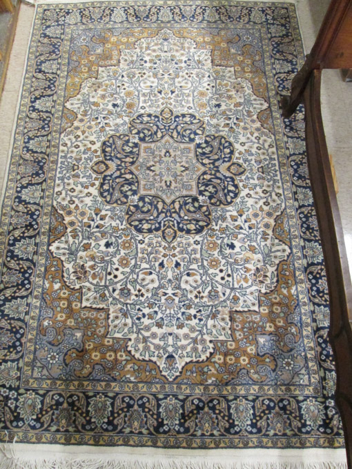 Appraisal: HAND KNOTTED ORIENTAL AREA RUG Pakistani-Persian floral and central floral