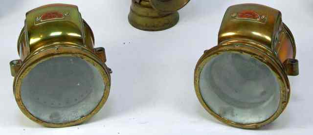 Appraisal: A pair of Astra brass commercial lamps cm high