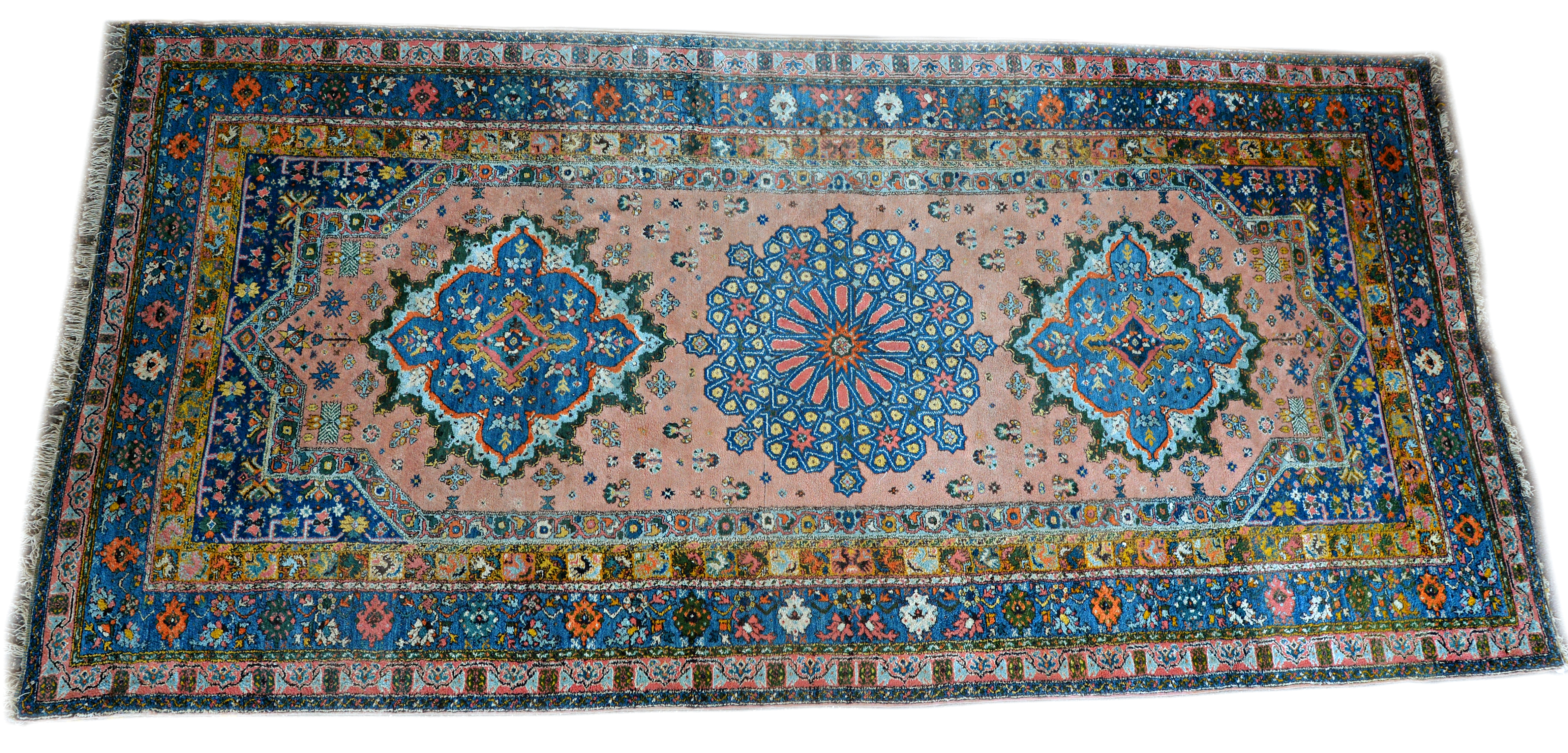 Appraisal: A Moroccan carpet the pink field with three bold medallions