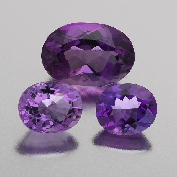 Appraisal: THREE UNMOUNTED CT TOTAL AMETHYST GEMSTONES from mm x mm