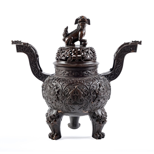 Appraisal: A Chinese bronze censer the domed cover surmounted by dog