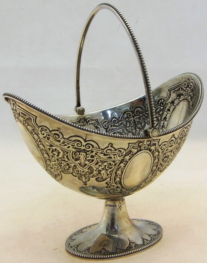 Appraisal: A Victorian silver cream pail of oval form with embossed