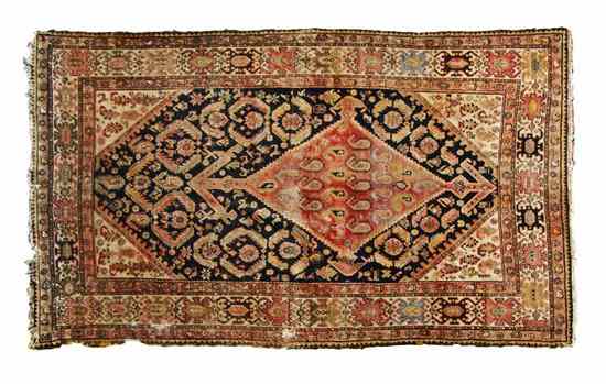 Appraisal: A Caucasian Wool Rug having a diamond form medallion and