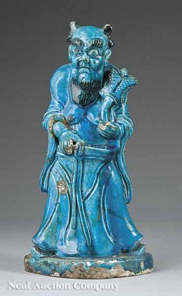 Appraisal: A Chinese Blue Glazed Pottery Figure the menacing figure modeled