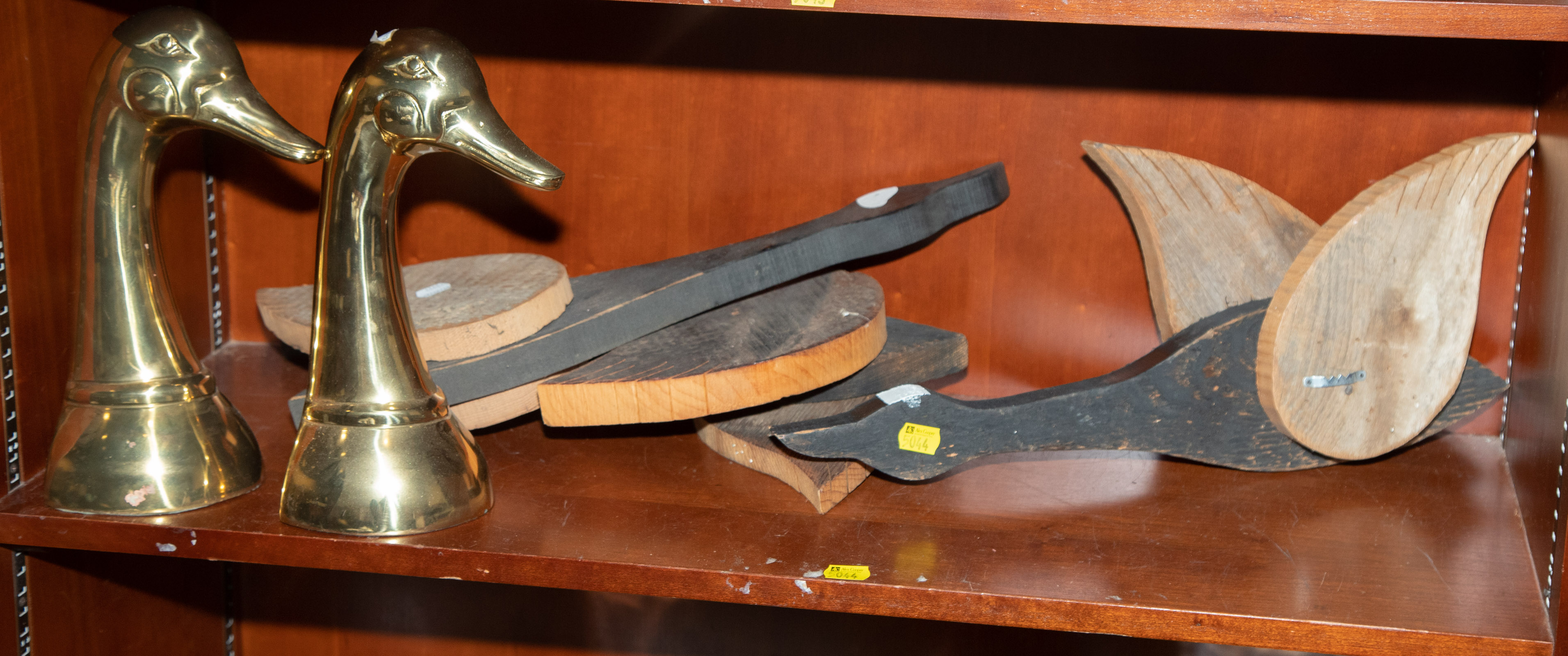 Appraisal: THREE CARVED WOOD GOOSE DECORATIONS DOOR STOPS Doorstops approximately in