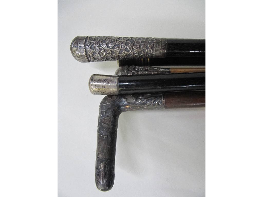 Appraisal: Lot comprising white metal topped walking stick and an umbrella