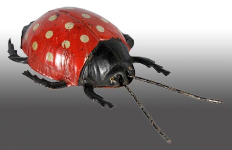 Appraisal: Tin Lady Bug Wind-Up Toy Description German Working Marked on