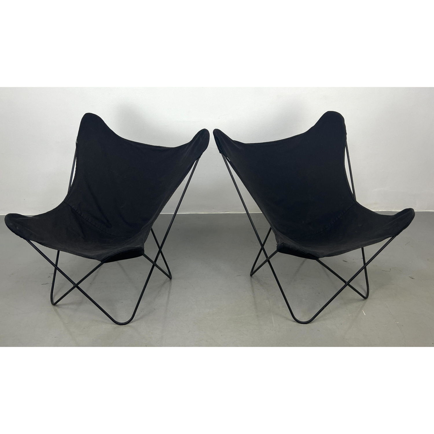 Appraisal: Pr Iron Butterfly Modernist Lounge Chairs Black Canvas Slings Seats