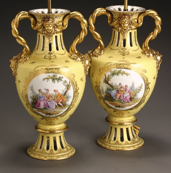 Appraisal: Pair of Continental Porcelain Pictorial Yellow Ground Urns Early th