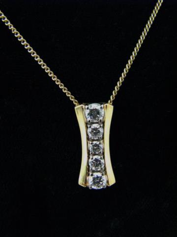 Appraisal: A K yellow gold pendant containing five round brilliant cut