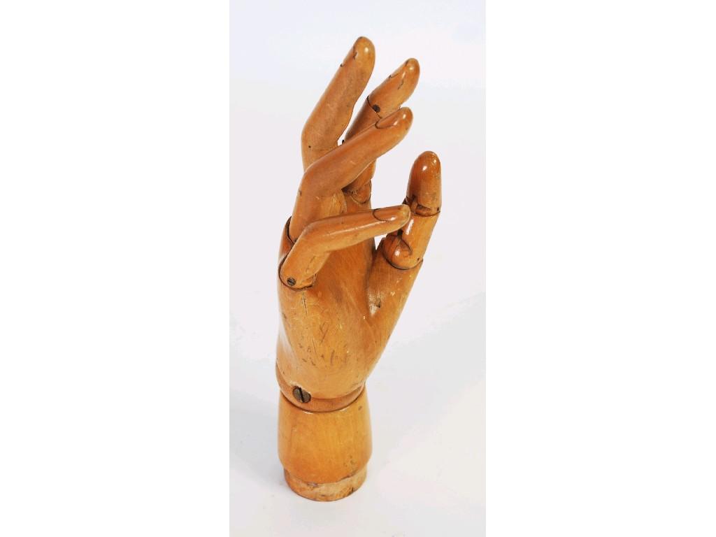 Appraisal: CARVED BEECH WOOD ARTICULATED HAND in longEST -