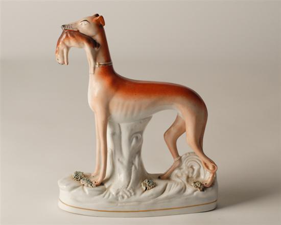 Appraisal: th C Staffordshire Whippet with rabbit in its mouth high