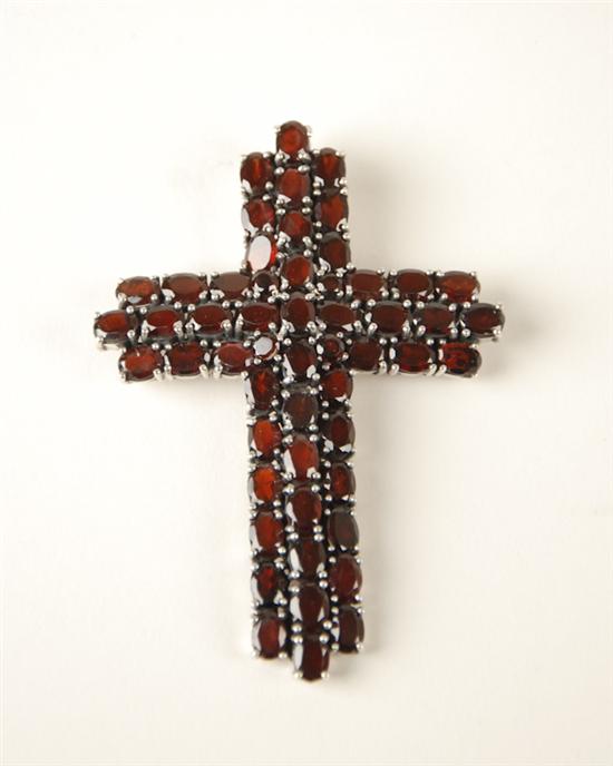 Appraisal: A Sterling and Garnet Cross Pendant the heavy sterling mounting