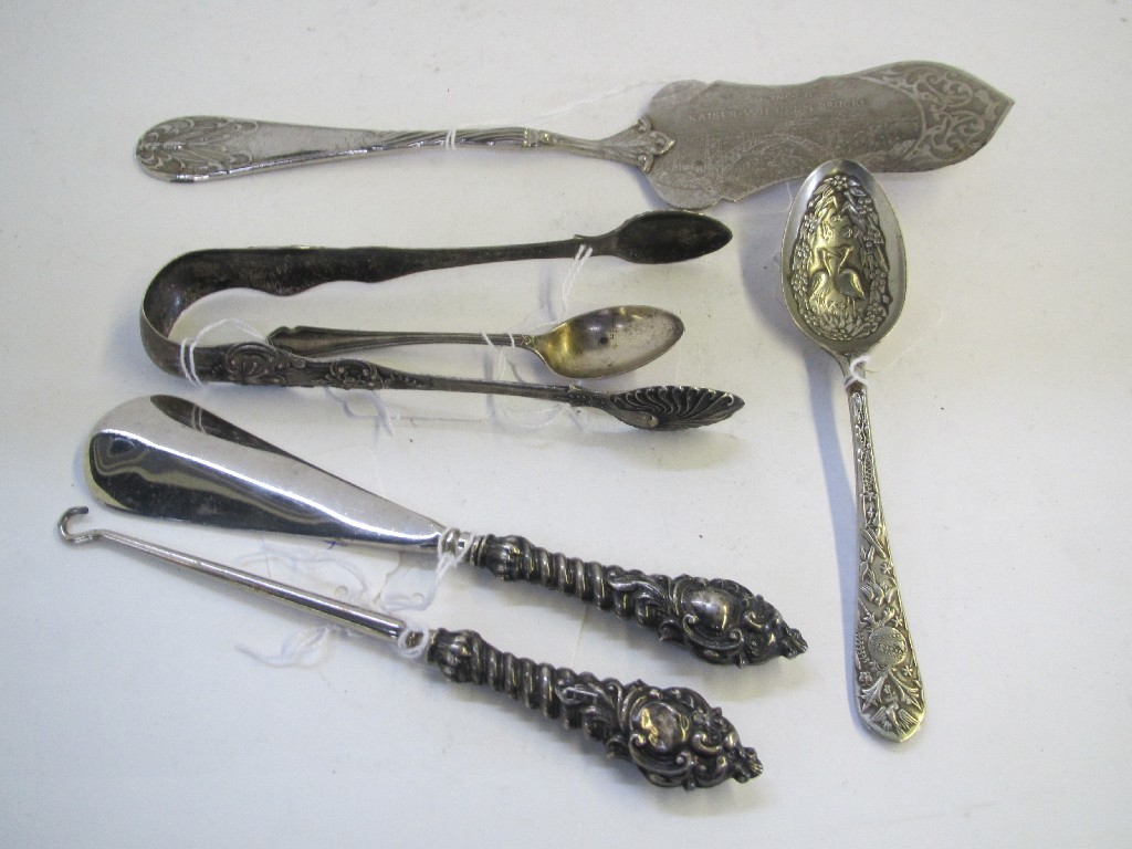 Appraisal: A lot comprising silver tongs silver spoon shoehorn and buttonhook