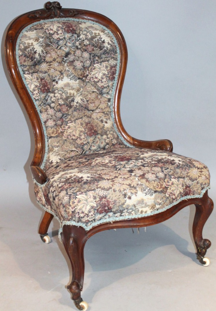 Appraisal: A thC walnut framed spoon back open chair with button