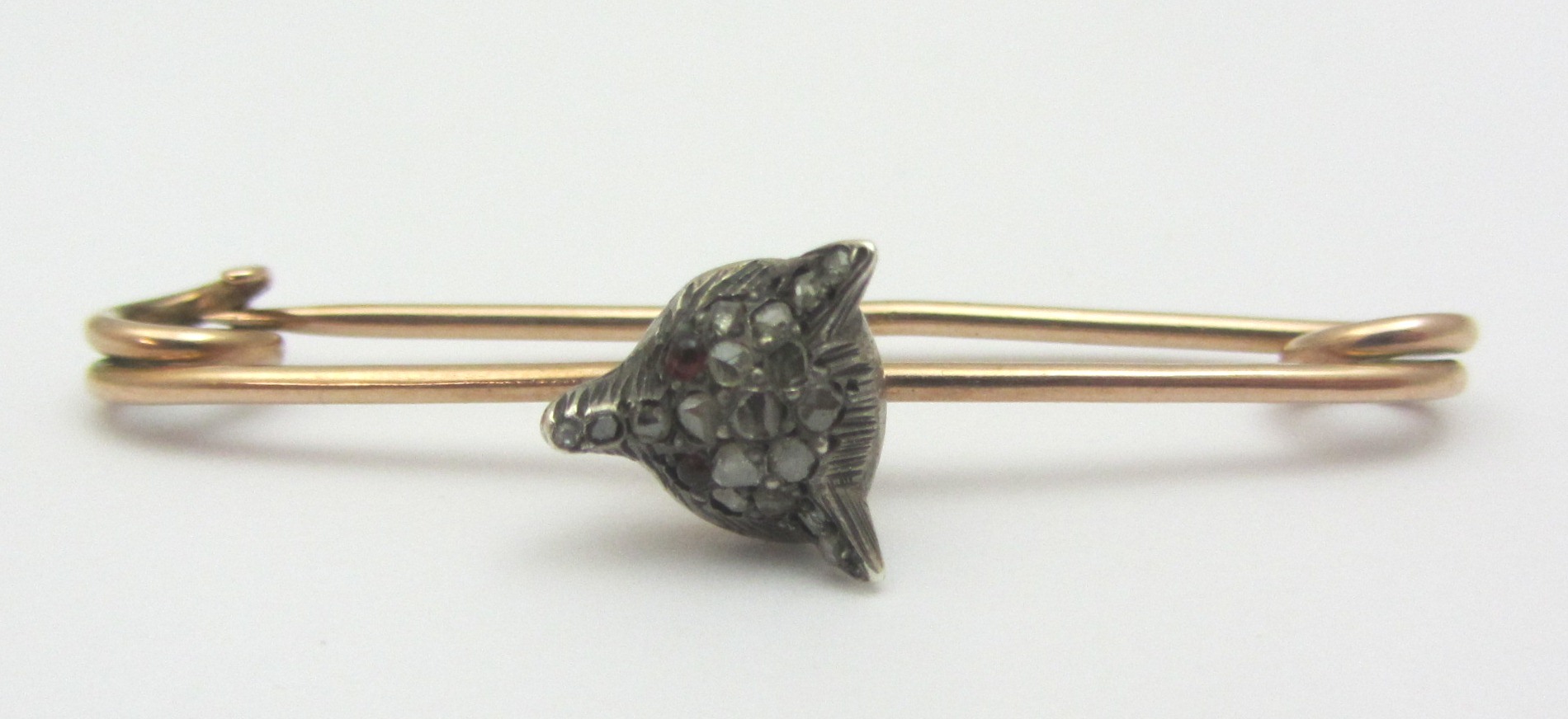 Appraisal: A rose diamond set bar brooch with a foxes mask