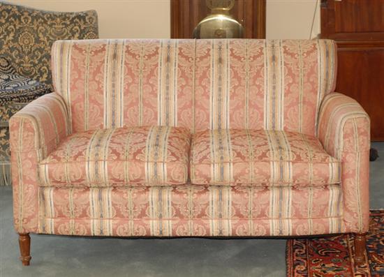 Appraisal: An Upholstered Loveseat with turned front and splay back legs