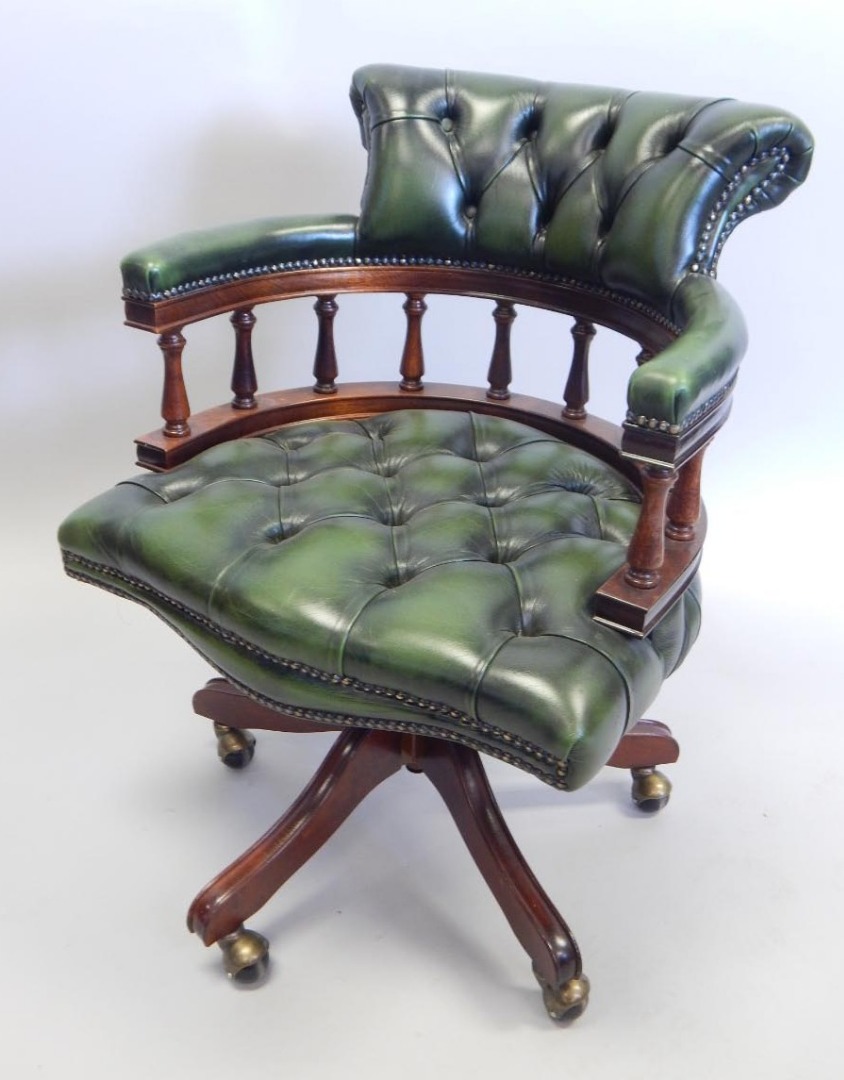 Appraisal: A thC mahogany and green leather upholstered revolving office chair